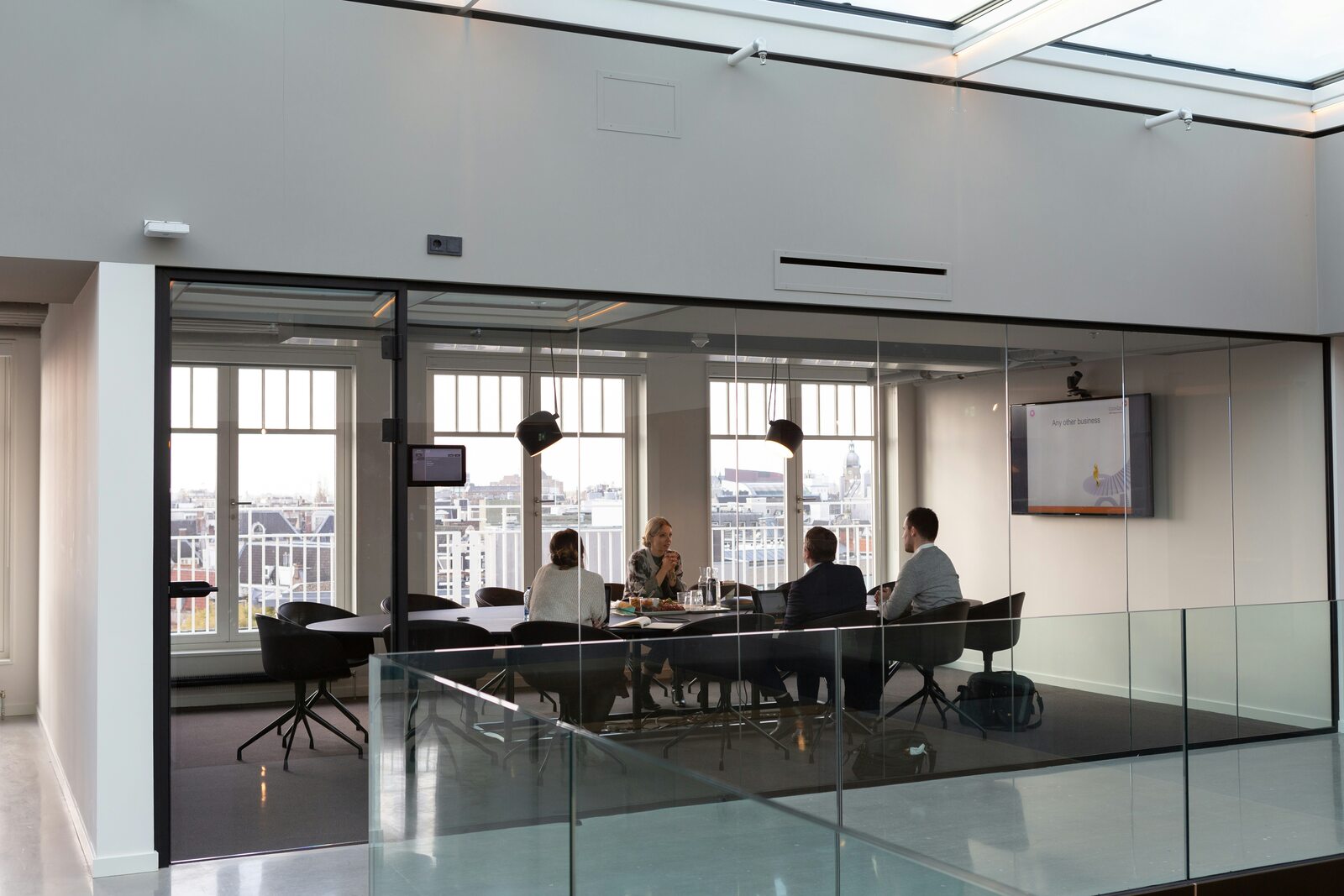 Business professionals meeting around a table in a modern office